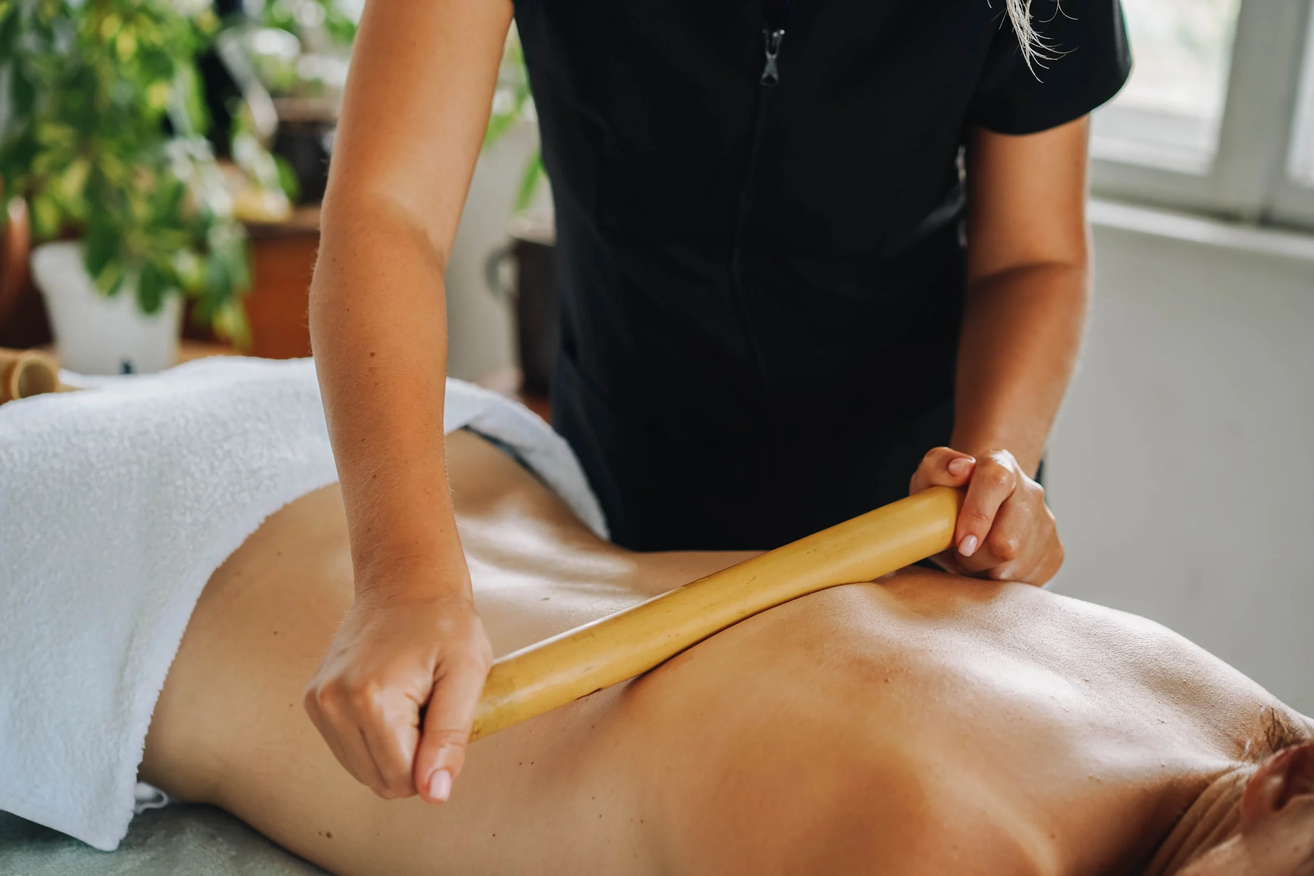 Therapist performing a soothing lymphatic drainage massage at Hamzafied Beauty Lounge